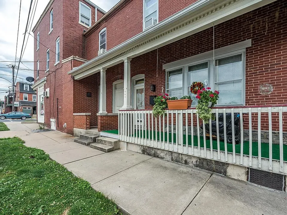 Cozy side porch perfect for relaxing.