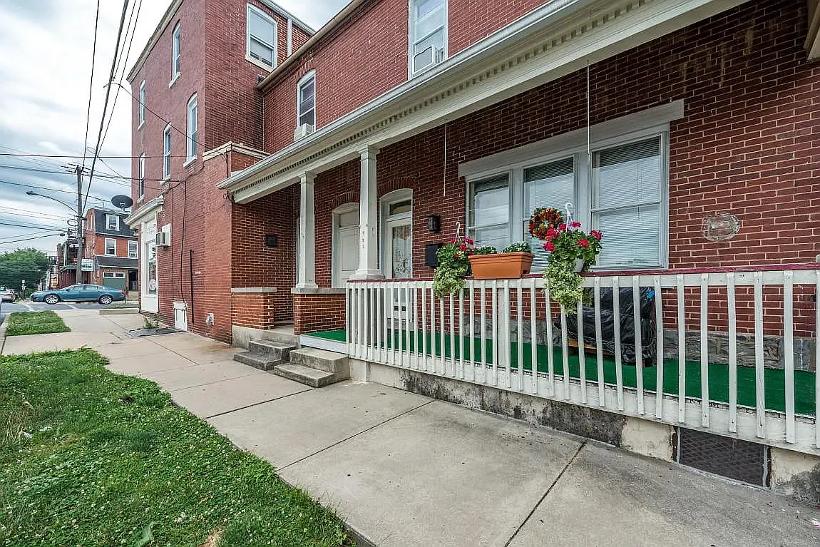 Cozy side porch perfect for relaxing. - 353 E New St #2
