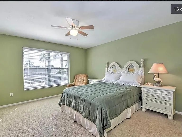 Large master bedroom, queen sized bed, private bathroom, TV.
