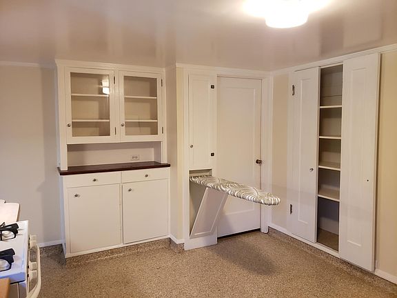 A built in Ironing board and large pantry