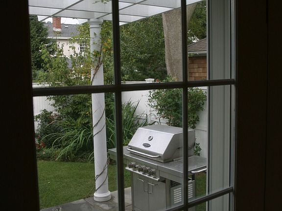 Back patio with arbor