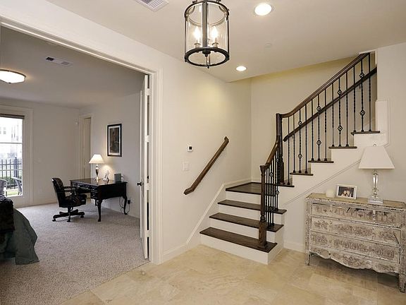 This beautiful front entryway has access to the two car garage and the first floor bedroom.