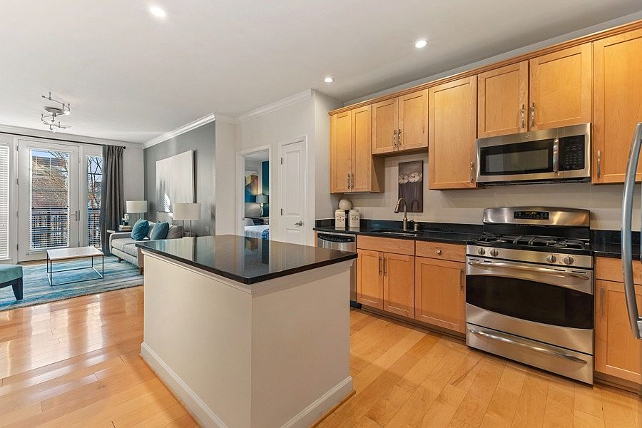 Gourmet kitchens with 42" wood cabinets and granite countertops