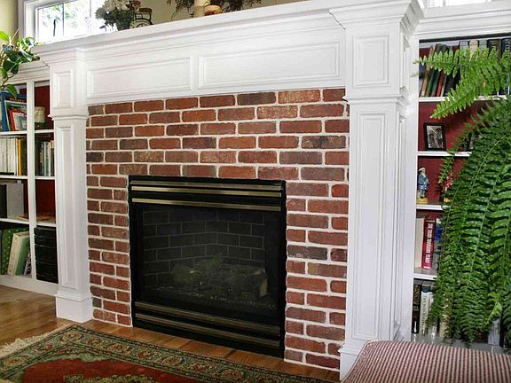 Gas fireplace flanked by built-ins