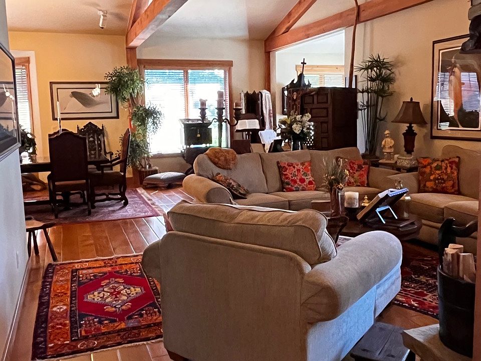 Open Living and Dining Rooms with plenty of sitting areas to relax and read a book