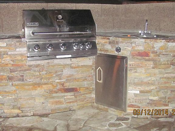 Large bar-b-que island with sink