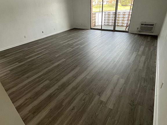 living room with balcony and water views