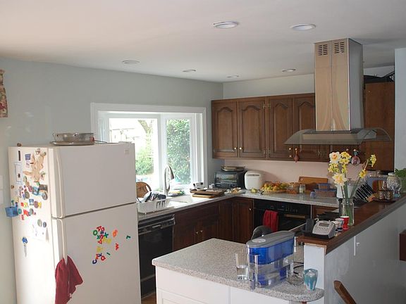 The giant bay window has beautiful views into the garden.