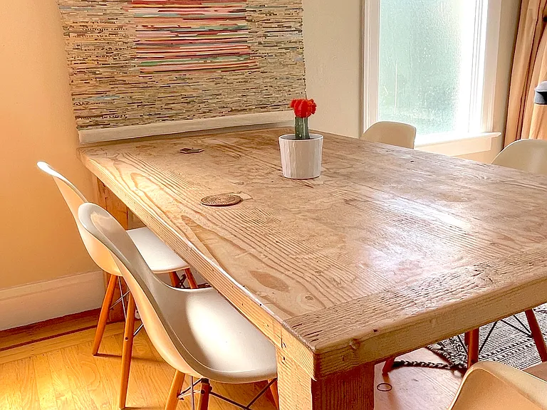 Dining table in dining room, with vintage eames chairs.