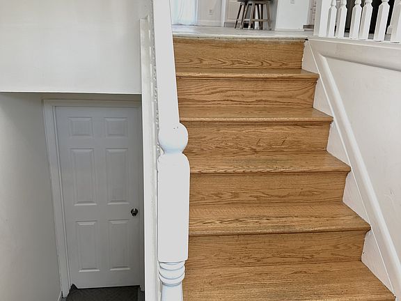 Split Foyer Entrance - steps to basement living space to the leftt and steps to Main Living Area to the right.