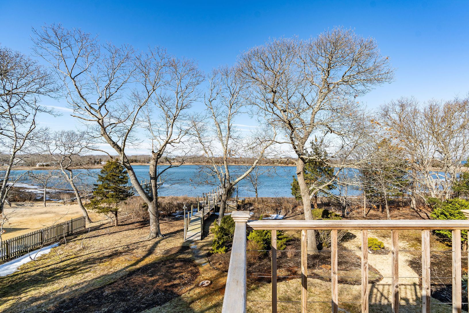  Deck overlooking the water from the upstairs primary suite