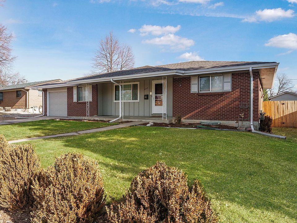 large covered front porch with attached garage
