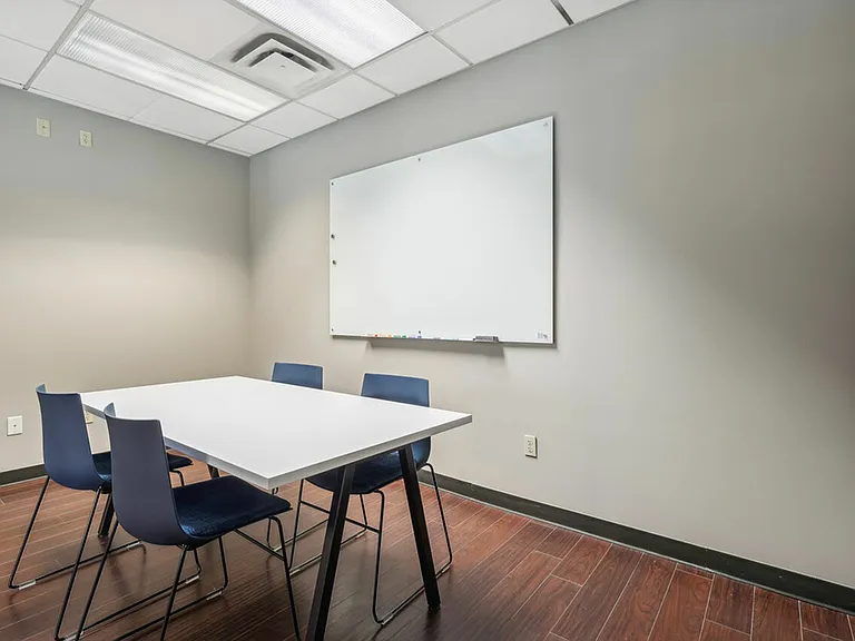 Focus and collaborate in the private study room at University Oaks Apartments near Kent State University.