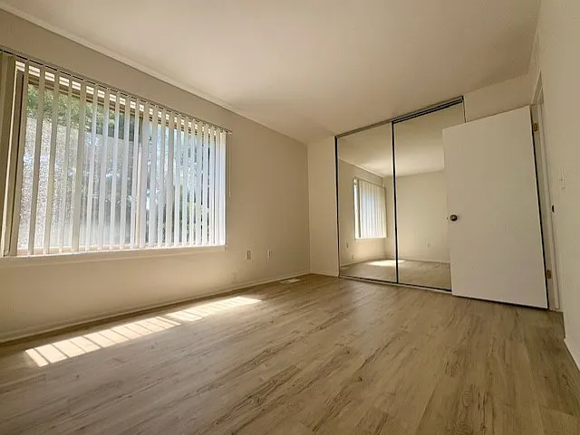 2nd bedroom with 8 ' tall mirror closet doors