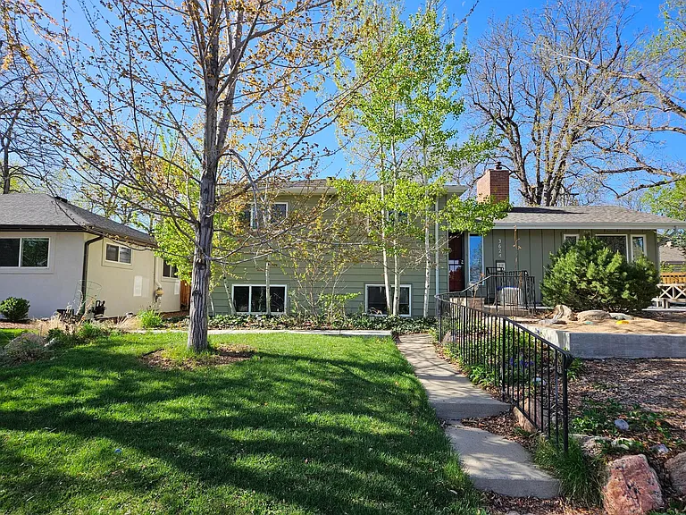 Front/Street view of the main house.
Sidewalk to enter the garden-level dwelling on the left, the bottom windows represent the apartment.