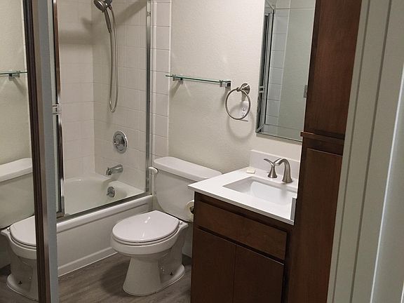 Bath has new paint, flooring, countertop, sink & faucet, mirror, heater & shower head. Newer tub and surround.