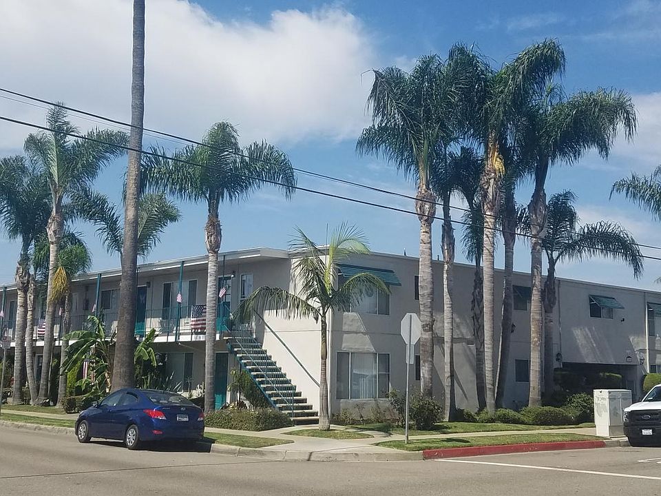 Corner property surrounded by palm trees