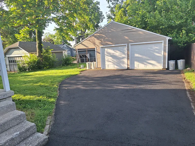 Garage with covered patio at side. Each unit gets one car garage