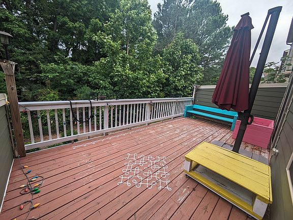 Deck from Kitchen and Dining area - Lush wooded backyard