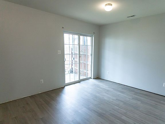 Extra living/bedroom space on ground floor. Sliding doors to fenced backyard