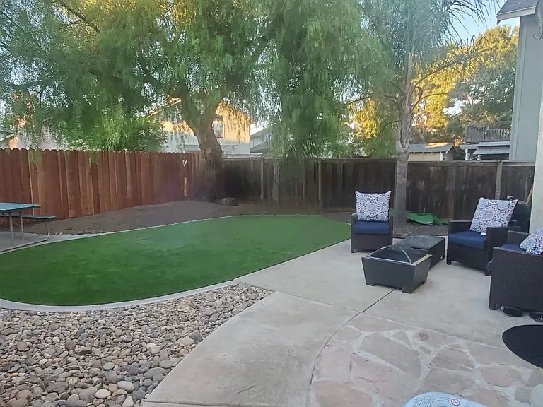 Nice size backyard with artificial grass