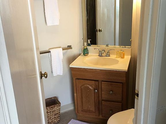 The bathroom is also small but functional, with a sink, toilet, and shower (shown on the next picture)