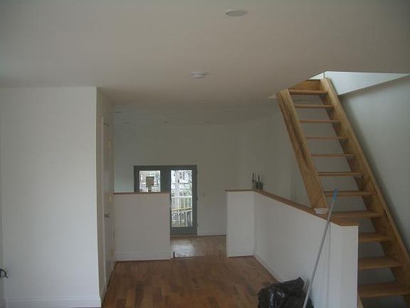 3rd floor living room with Bath Room. Stairs to Pent house