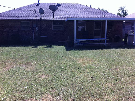 Rear view w/ covered patio