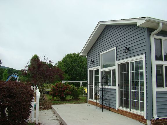 Back of house with patio