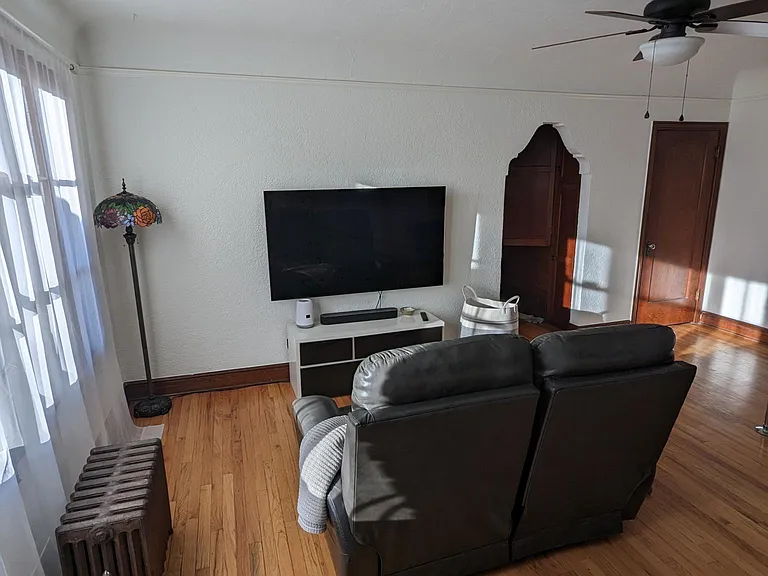 living room with laundry closet