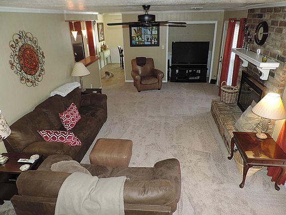 HUGE Den with Recent Plush carpets With Wood burning fireplace!