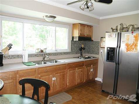 Upgraded Stainless Appliances*Beautiful New Kitchen*Awesome New Glass Tiled Backsplash! Easy Care Laminate Wood Flooring!