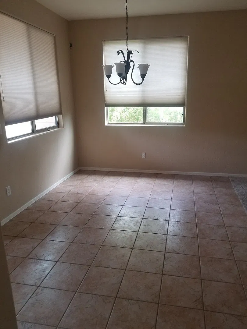 Welcome to your spacious 4-bedroom home in Surprise — Photo 1