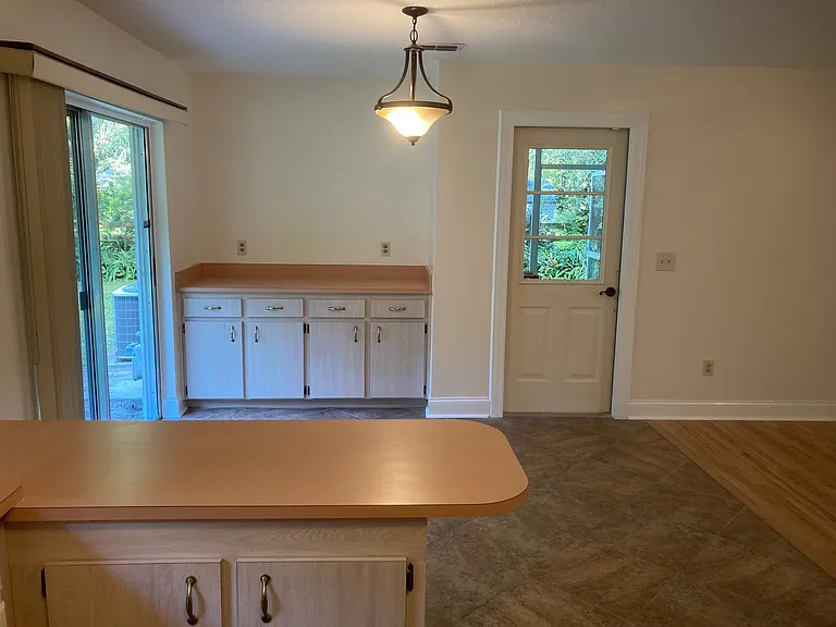Dining; side door leads to screened patio