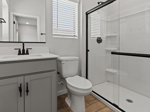 Primary bath with matte black finishes
