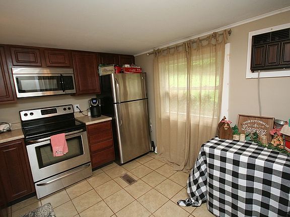 Walnut cabinets - Tile floor