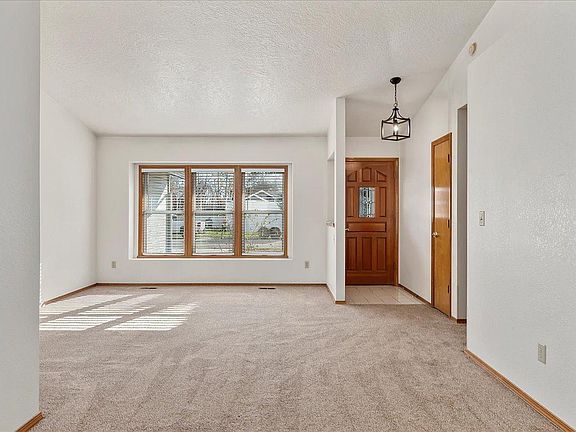 Vaulted ceilings in living room and dining room. New lighting