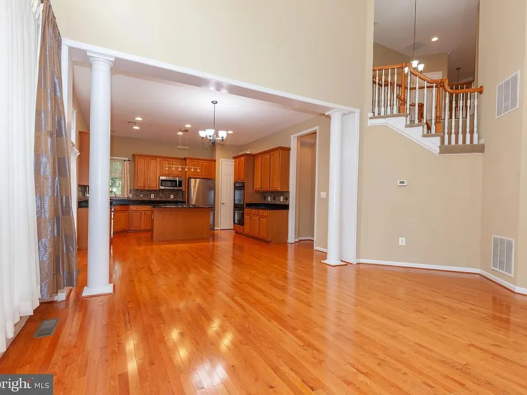 Great Room/ Family Room with 19' cathdral ceiling, lots of windows to let in natural light