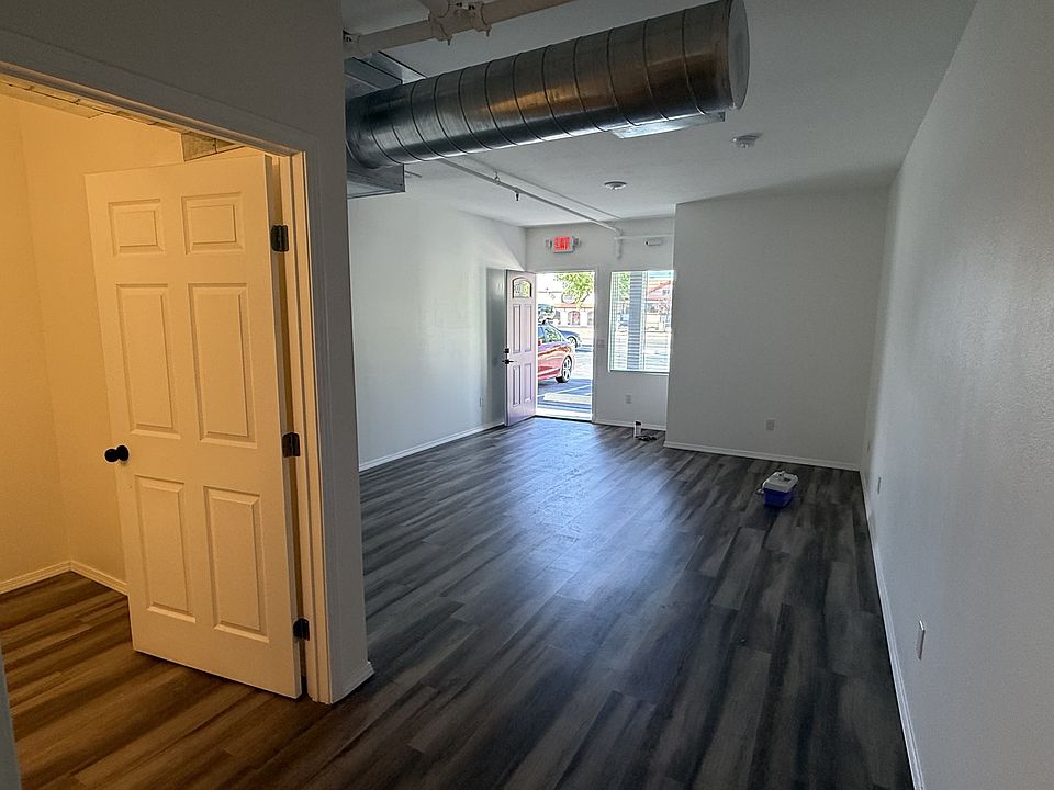 View into the front room from the hall that leads to the dining room
