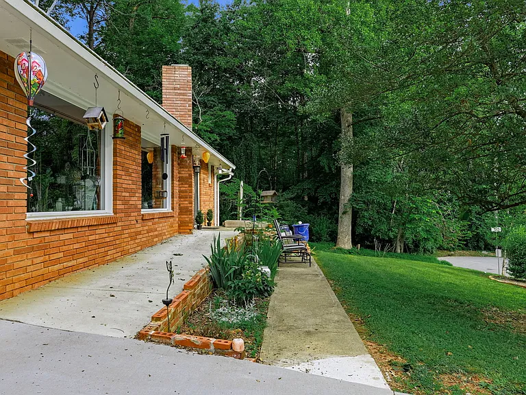 FRONT YARD: Accessible Ramp to Front Porch, original walkway to seating area and gardens