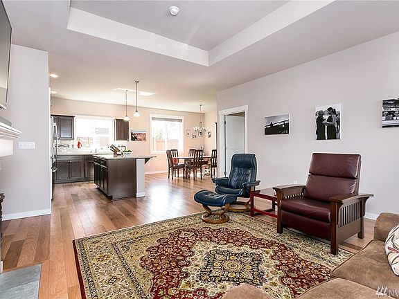 From main entry, view of living room toward kitchen.  