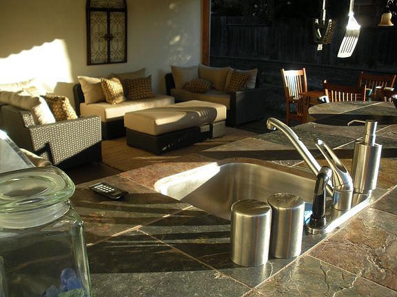 Custom Outdoor Kitchen w/permanent natural gas, hot and cold water, and drain