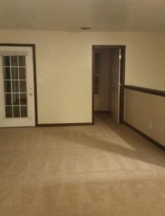 living room and bonus room, door to deck