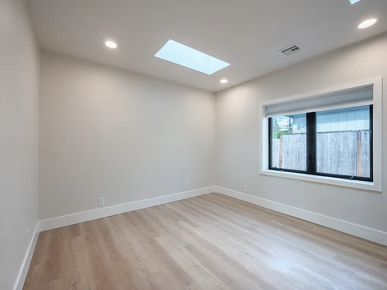 Bedroom #2 , closet organizers w/ 2 skylights and large window.