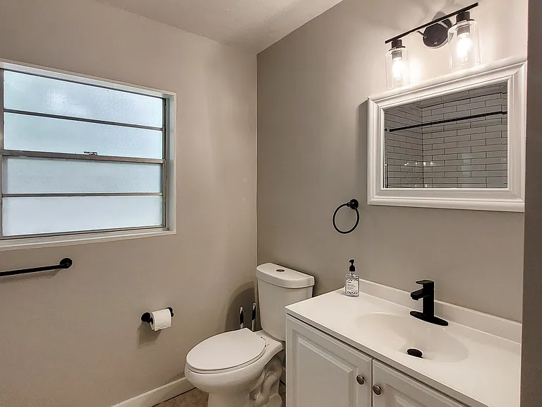 First bathroom, right side of the house.