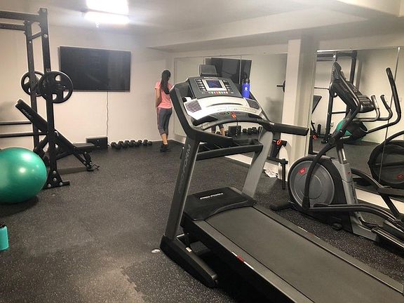 Extra Storage/Gym Area in Garage with Mirrors Installed (Equipment not included)