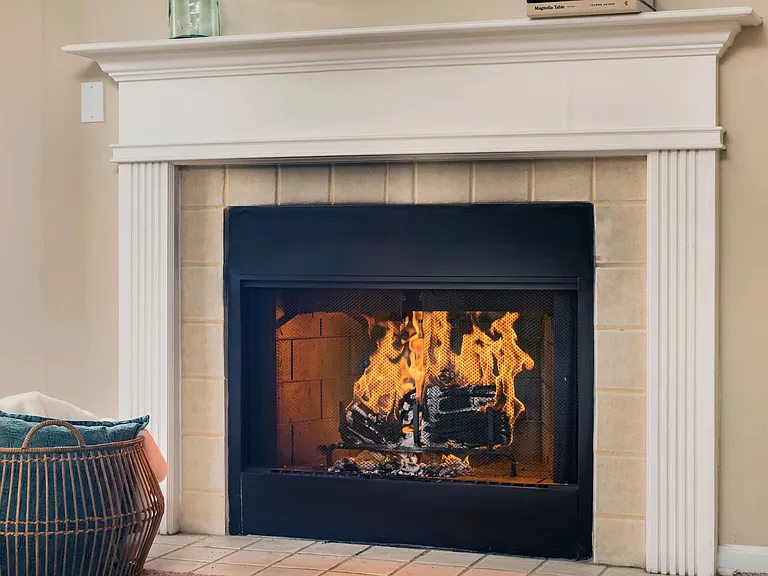 Embrace the ultimate coziness with the warm glow of a fireplace, adding charm and comfort to your deluxe living space (in select units).