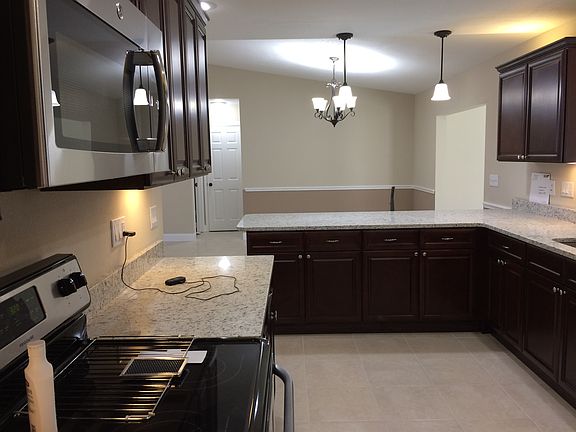 view from pantry to dining area noted by chair rail.