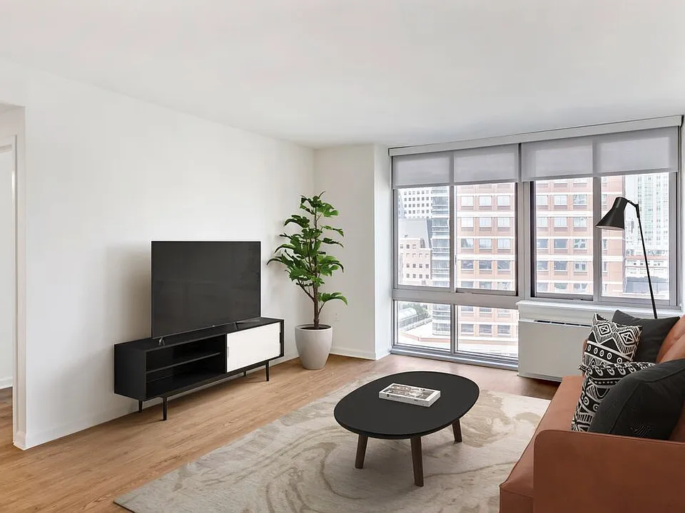Renovated Package I living room with hard surface flooring