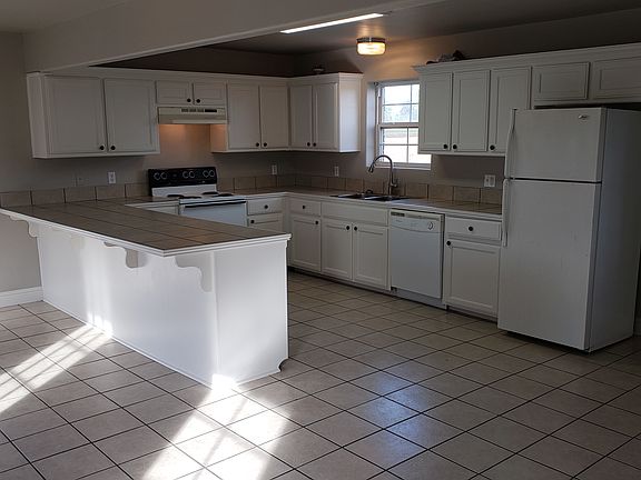 Kitchen includes: stove, fridge, dishwasher and lots of storage